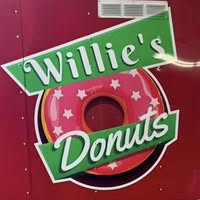 Willie's Donuts logo — pink donut with green banners
